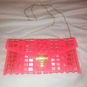 Hot pink cutout clutch
